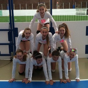 JO Girls Volleyball team having fun team pyramid